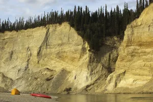 Camp, tent and canoe on a gravel bar