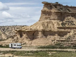 Camper van, desert, rock formation Tozal Colasico