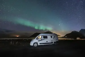Category Scandinavia Prints: Campervan stands at Flakstad beach with northern lights
