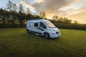 Category Scandinavia Prints: Campervan stands on the lawn of Uge Lystfiskeri og Camping at sunrise