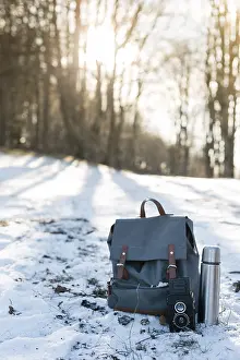 Camping elements equipment on the mountain at the winter time next to the bonfire