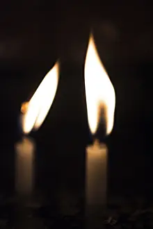 Candle lights in the darkness. Abstract candles background
