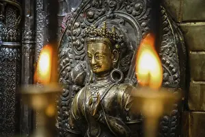 Candles burning inside one of the Buddhist temples in Nepal