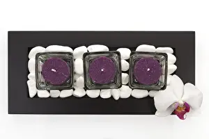 Candles with white stones and orchid blossom zen like spa background