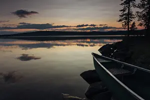 Canoe on shore at sunset, Lake Vaekkaeraejaervi