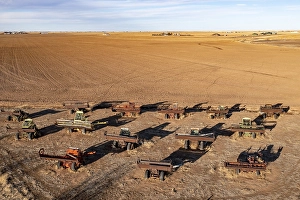 Canyon, Texas, Combine City, where a dozen old farm combines are partially buried in a field