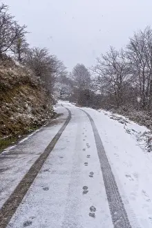 Car tracks on the road to mount aizkorri in gipuzkoa
