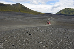 Category Mountain Landscapes Prints: Caravan on dirt road in barren volcanic landscape