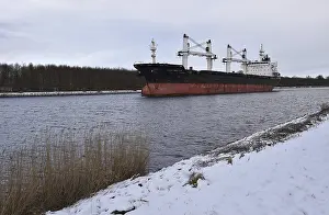 Cargo ship Lilly Bolten sailing in the Kiel Canal in winter