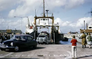 Cars coming off the Isle of Wight ferry, Camber Queen, Portsmouth, Hampshire, England, in 1962