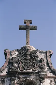 Carved facade of fort with cross