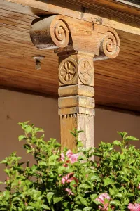 Carved wooden column in the cloister