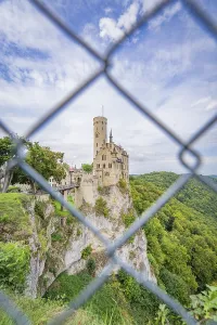 Castle on a hill seen through a lattice