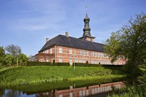 Castle in front of Husum with reflection in the castle moat in Husum