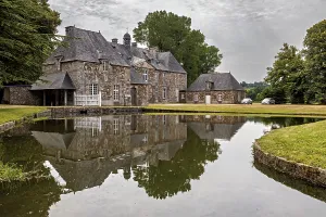 A castle with a pond in front of it