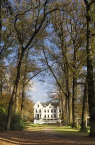 Castle Staverden near Ermelo in the Dutch region Veluwe seen from the surrounding autumn mooded park