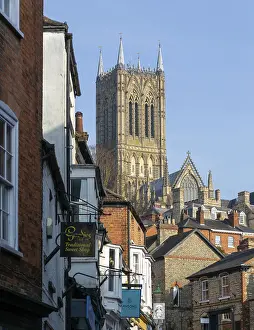 Cathedral tower rising above historic buildings