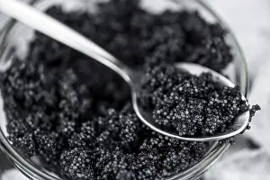 Caviar on a vintage looking slate slab (selective focus)