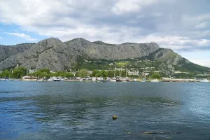 Cetina river with ships and boats in Omis, Croatia