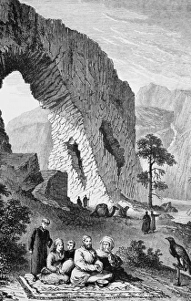 Chalcha Mongols at rest, family sitting on carpet outdoors, native Chalcha people, rest, food, mountain landscape, camel, tame falcon on a perch, travelling in Asia, Mongolia, historical illustration 1887, Asia