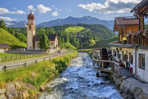 Chaplaincy church and old forge with water wheel on the Horlachbach