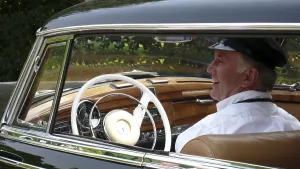 Chauffeur in a Mercedes Benz 300D