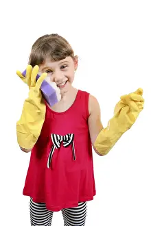 Cheerful Little Girl with Bath Sponge and Rubber Gloves Isolated on the White