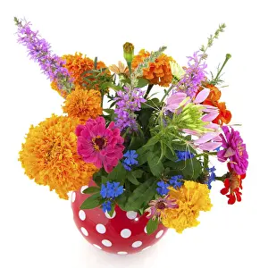 Cheerful summer bouquet flowers in speckles vase