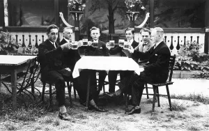 Cheers, men in a beer garden, historical image