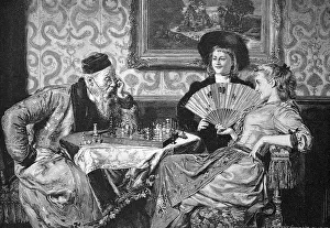 At a chess game, an older man plays against two young woman who are winning