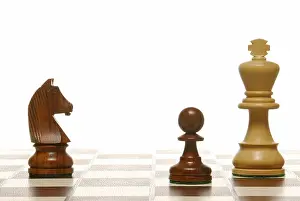 Chess pieces on a chess board, symbolic of strategy