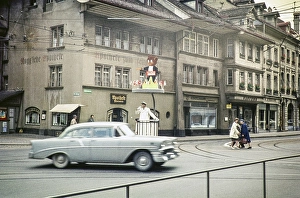 Chevrolet car passes a policeman directing traffic in the city of Bern, Switzerland, Europe 1961, Europe