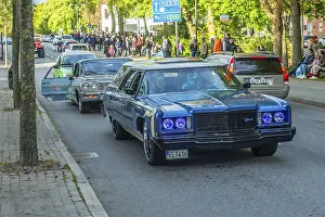 Chevrolet Impala 1975 in cruising with 100s of older American cars on the streets of Ystad