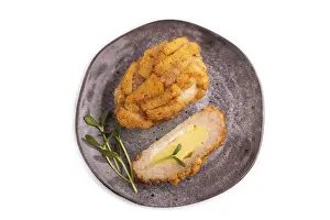Chicken Schnitzel on gray plate with microgreen Isolated on white background