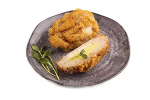 Chicken Schnitzel on gray plate with microgreen Isolated on white background