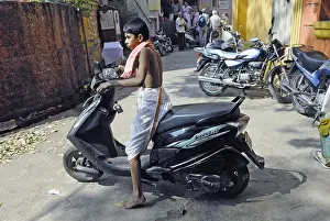 Category Historic EN Prints: Child driving two wheeler, Kolhapur