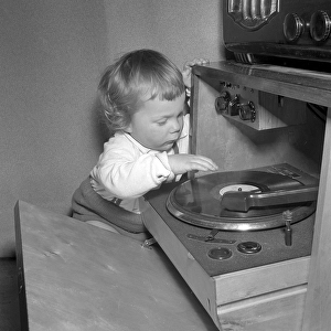 Child at a gramophone in the 1950s