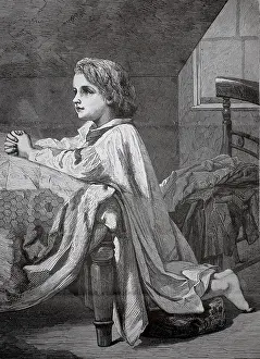 Child kneeling at bed for evening prayer