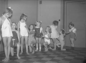 Children in the 1930s. A group of small girls at a dancing school playing together
