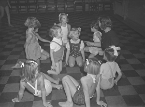 Children in the 1930s. A group of small girls at a dancing school playing together