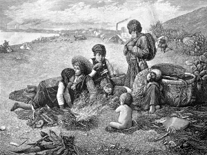 Children caught some small fish and roast them over the open fire on the beach