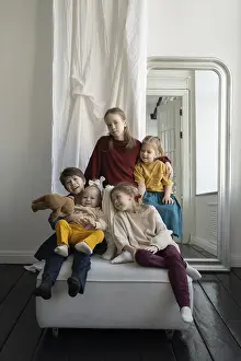 Five children, dressed in vibrant outfits