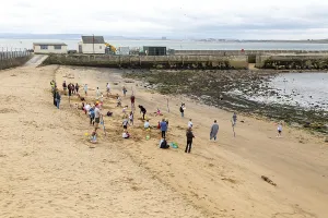Children enjoying summer holiday activities on sandy beach