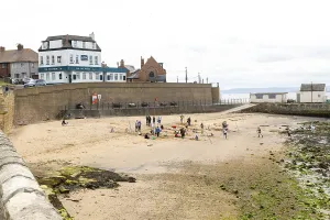 Children enjoying summer holiday activities on sandy beach
