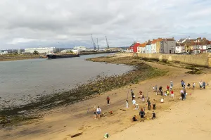 Children enjoying summer holiday activities on sandy beach