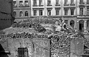 Two children in the garden on the ruins of a house