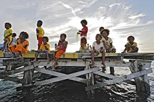Children on a jetty, Arborek, Raja Ampat