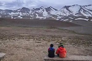 Two children observing the top of Ighil M'Goun