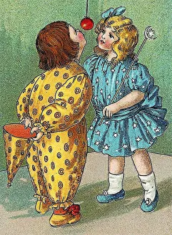 Children play, catching an apple with the mouth