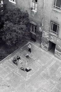 Children playing in the backyard of the house Stargarder Strasse 21